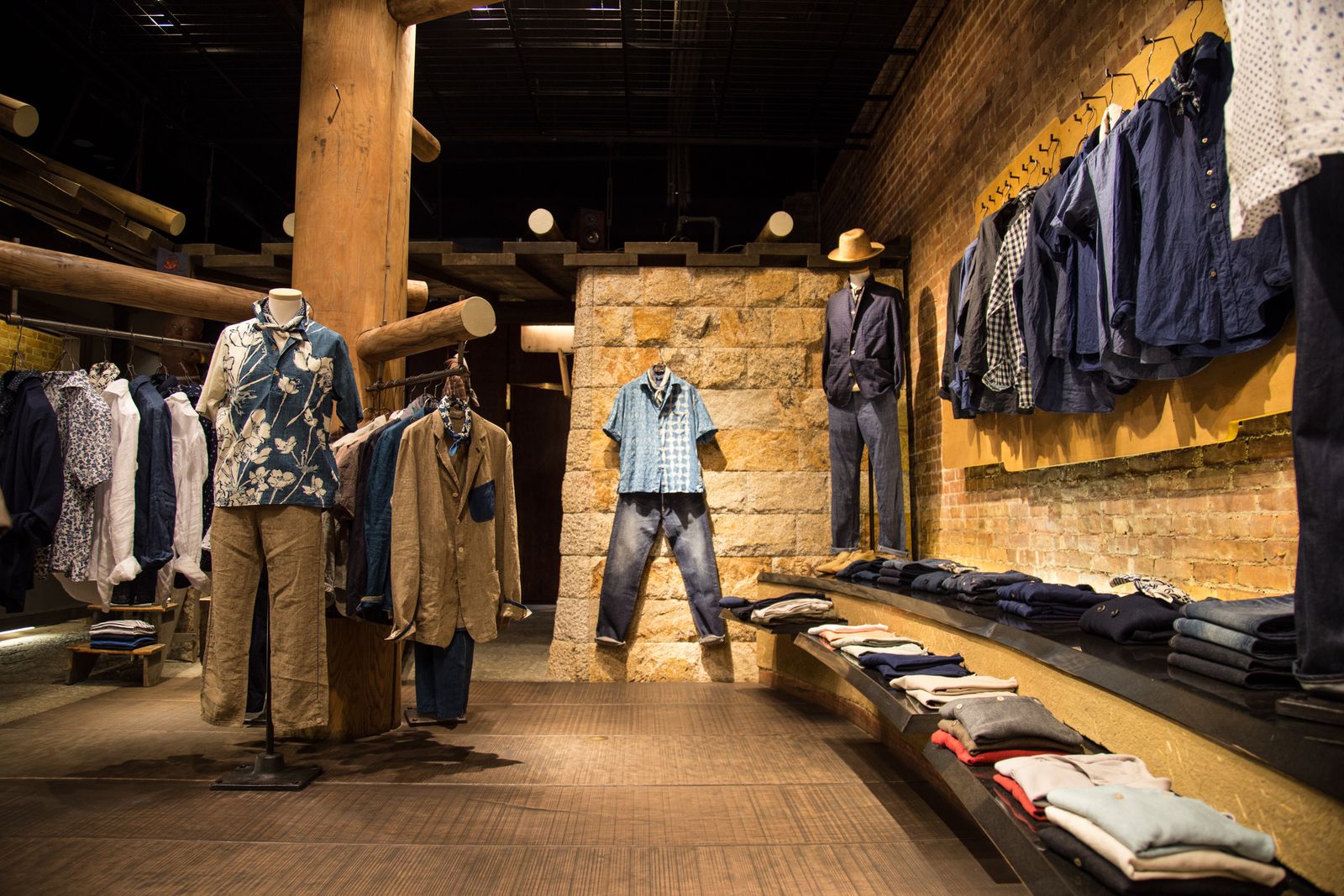 Store interior showing indigo work shirts, denim trousers and unstructured jackets on display