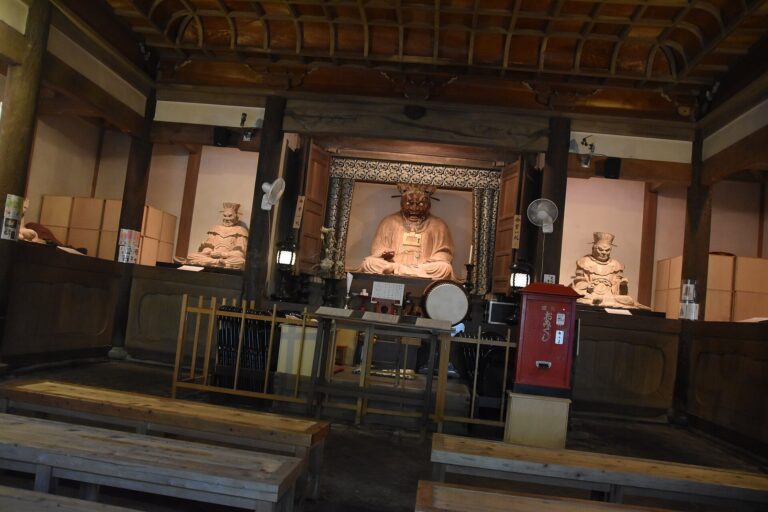 Wooden statues of Enma and the other judges of hell seated in a temple hall