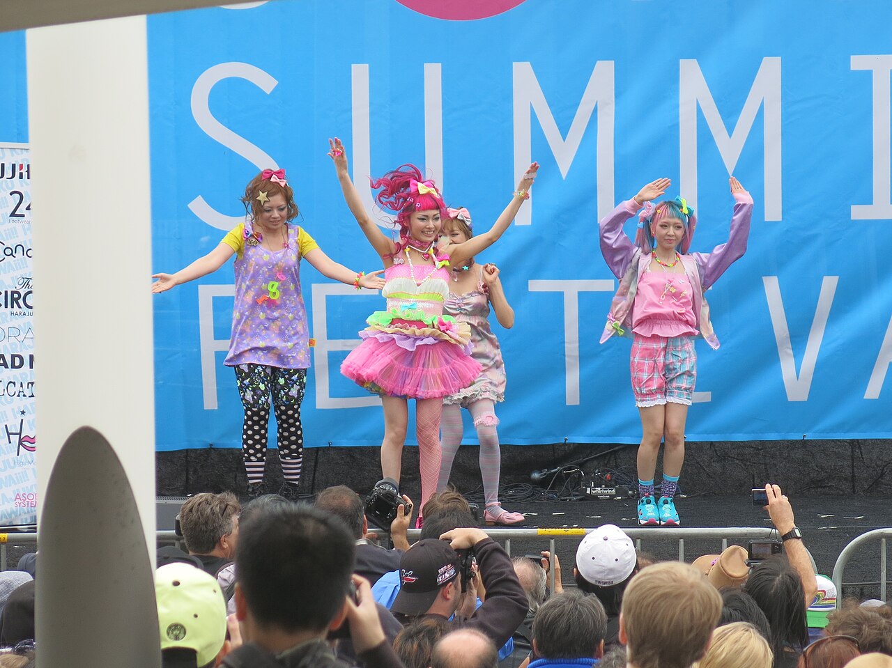 Harajuku models in pastel coordinates with a pink tulle skirt, pastel tights and hair bows