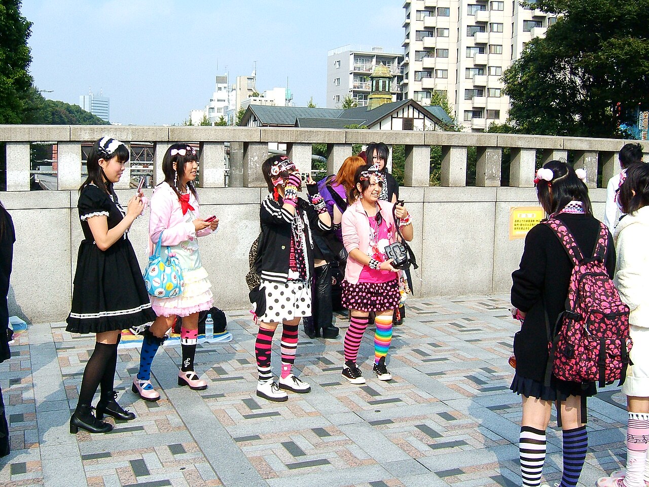 Harajuku street coords combining a pastel pink cardigan, polka dot skirts, striped socks and mary janes