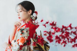 Woman wearing a formal furisode kimono with long sleeves outdoors