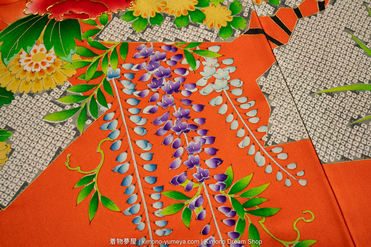 Furisode kimono laid flat showing the full sleeve length and pattern