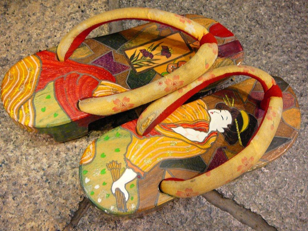 Hand painted geta decorated with a kimono clad figure in ukiyo-e style