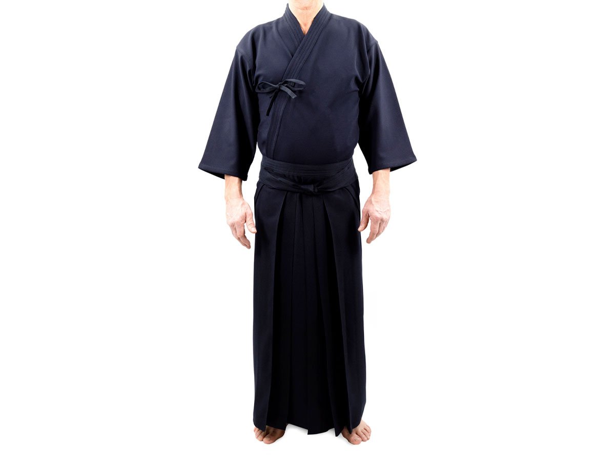Man wearing a navy training kimono top with a pleated umanori hakama over it