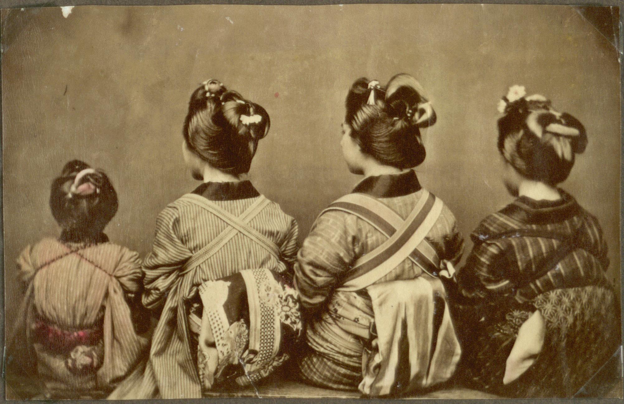 Four women in kimono seen from behind, showing the obi tied in different bow styles with the kimono collar visible at the nape
