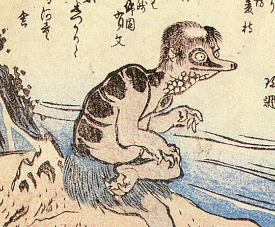 Woodblock print of a kappa with a beaked face, hairy scalp and scaled shell crouching beside a river