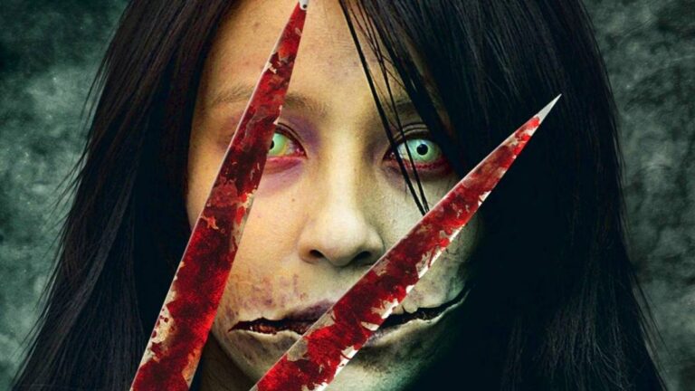 Pale long-haired woman with a mouth cut open at both corners, seen behind two blood-streaked blades