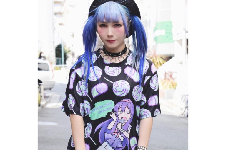 Harajuku street style outfit with blue twin tails, a spiked ring choker and an oversized pastel graphic tee