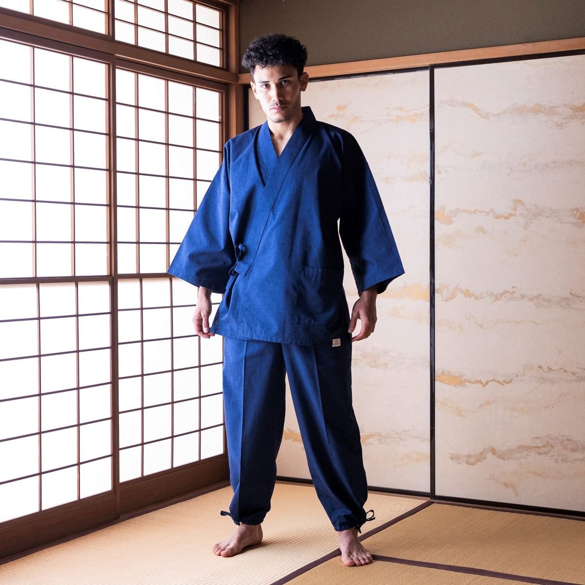 Indigo dyed samue jacket and trousers worn in a tatami room