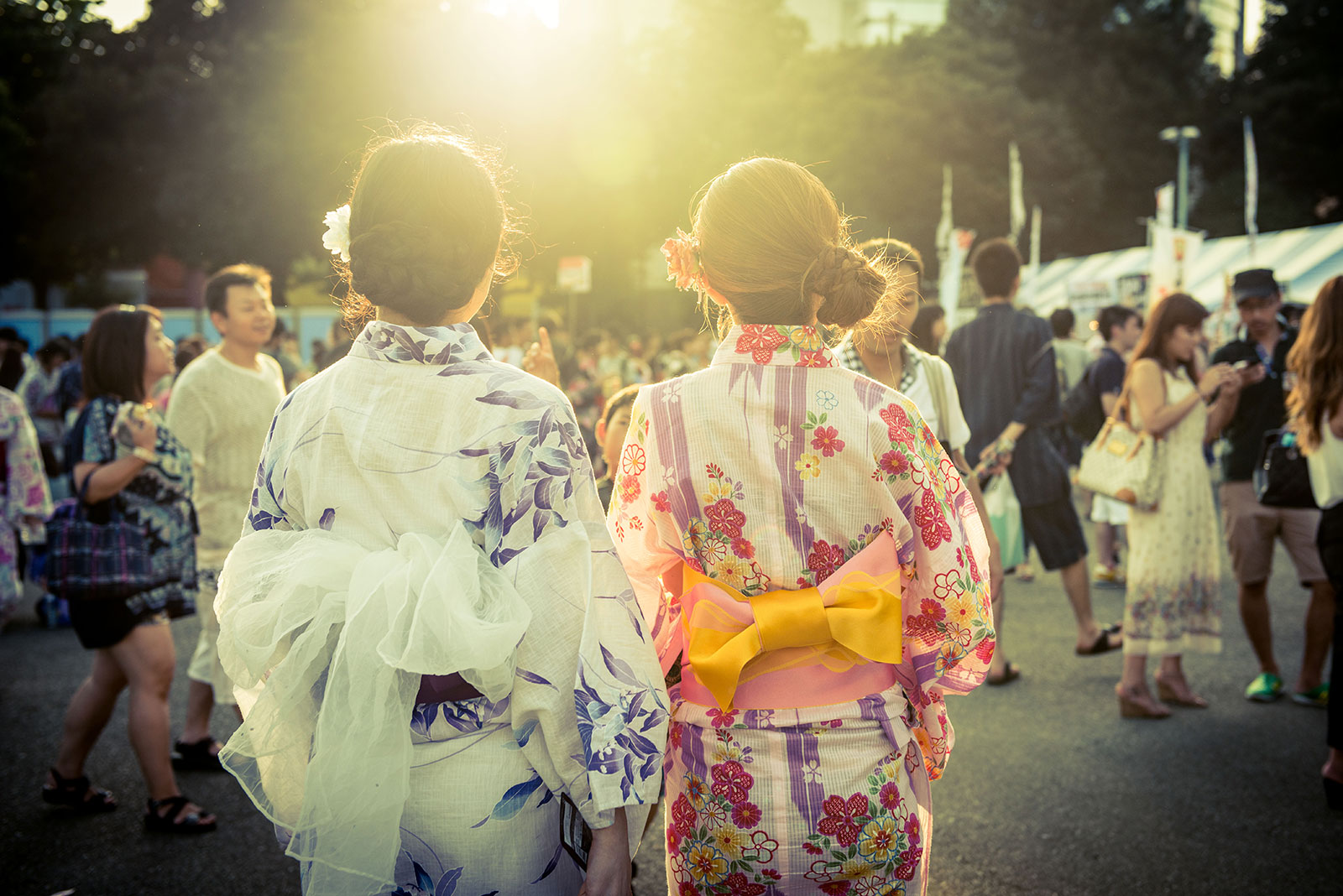 Woman wearing a patterned cotton yukata with an obi sash