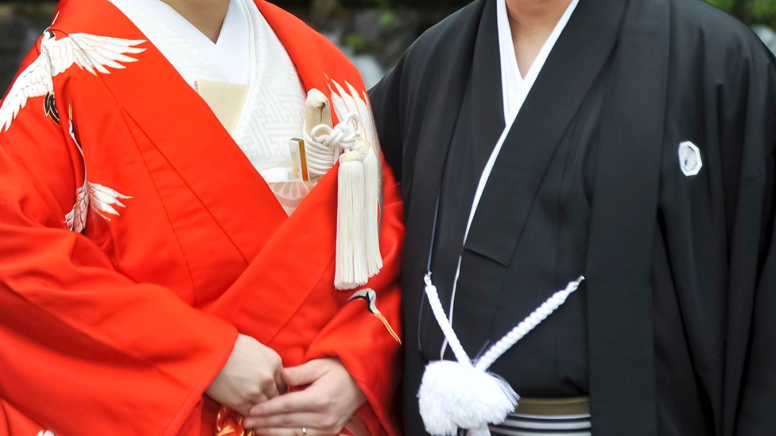 Bride and groom dressed in traditional Japanese wedding kimono