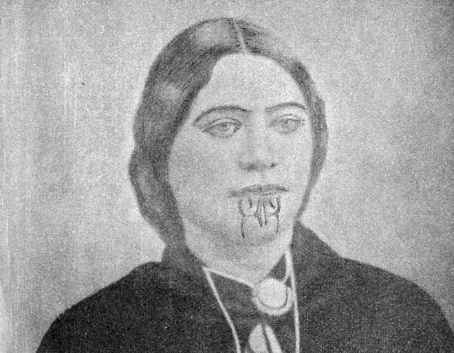 Portrait of Puhiwahine Rihi Te Rangi-Hireawea wearing a moko kauae on her lips and chin